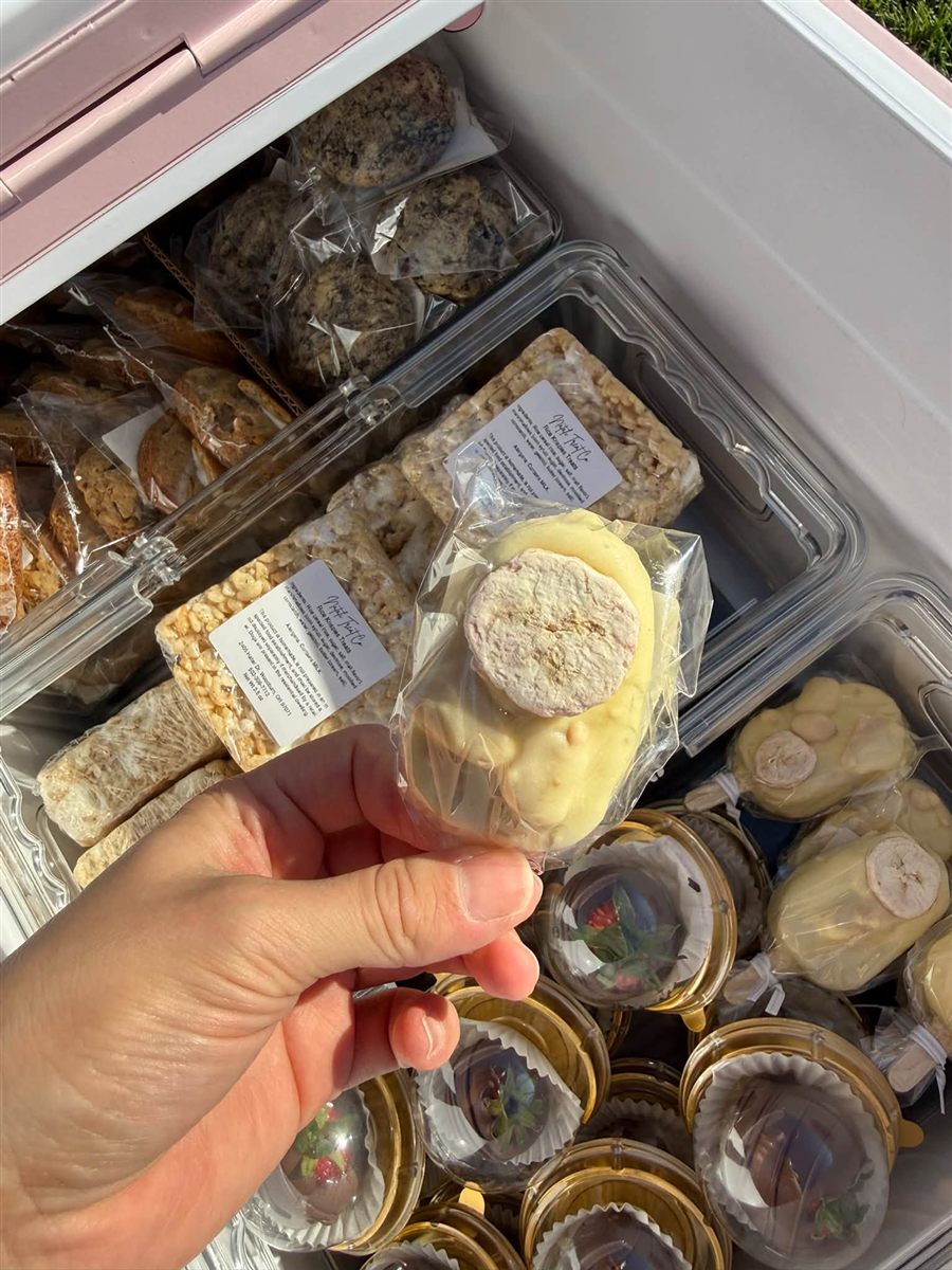 Individually wrapped cake pop held up at the treat stand